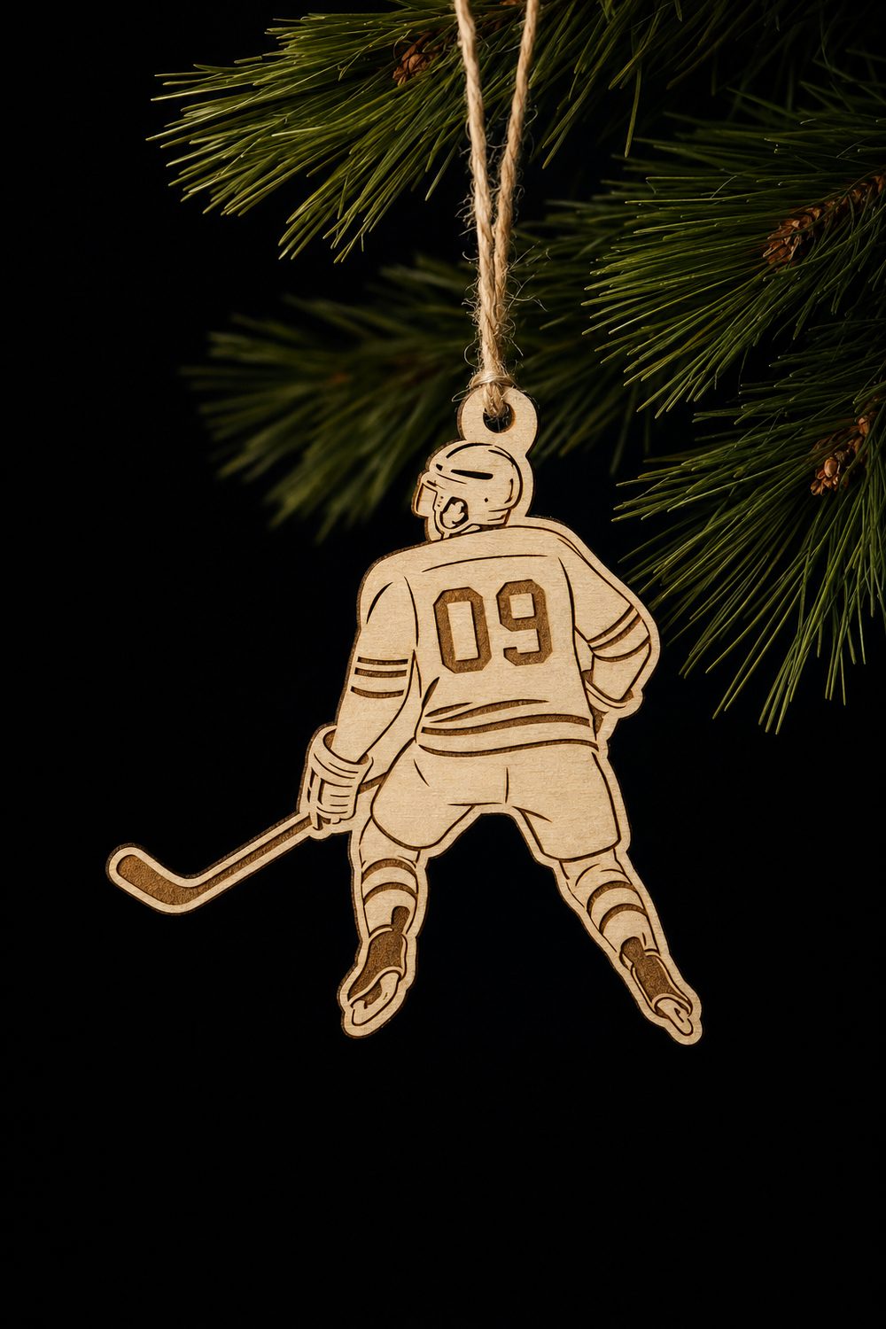 Laser-cut wooden hockey player ornament with jersey number 09